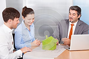 Couple And Consultant Discussing Together