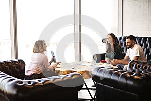 Couple consulting with real estate agent photo