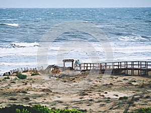 Couple contemplating the sea on a beach