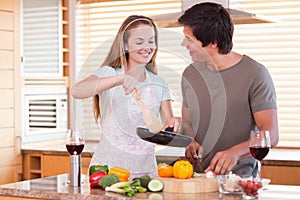 Couple cooking dinner