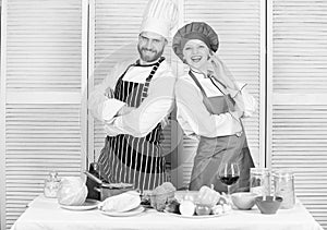 Couple cooking dinner. Woman and bearded man culinary partners. Delicious family dinner. Reasons couples cooking