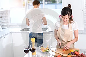 Couple cooking food in kitchen room, Young Asian man and woman together