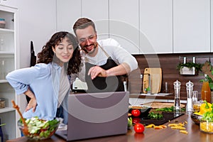 Couple cooking together.