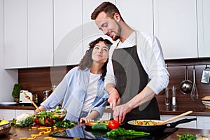 Couple cooking together.