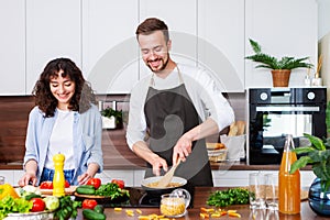 Couple cooking together.