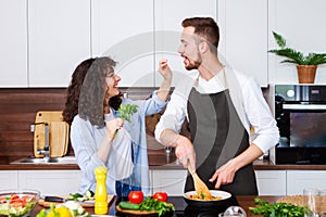 Couple cooking together.