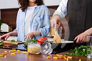 Couple cooking together.