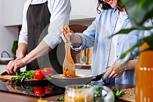 Couple cooking together.