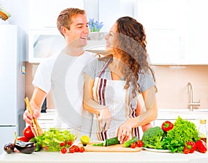 Couple cooking together in their kitchen