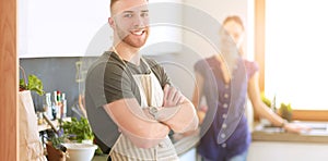 Couple cooking together in their kitchen at home