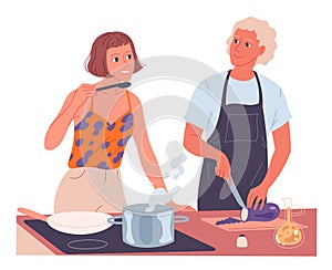 Couple cooking together. Woman cooks on the stove, man chops vegetables