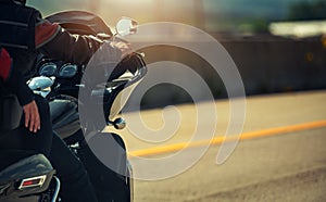 Couple Cruising on a Motorcycle Along a Highway