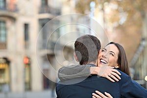 Couple cuddling after marriage proposal