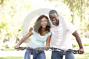 Couple On Cycle Ride in Park