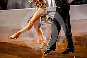 a couple dance a Latin dance. the legs of a dancing couple