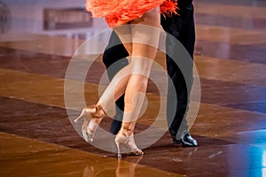 a couple dance a Latin dance. the legs of a dancing couple