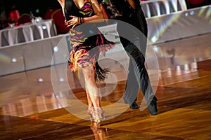 a couple dance a Latin dance. the legs of a dancing couple