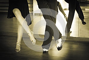 Male and female legs dancing latin rhythms and swing photo