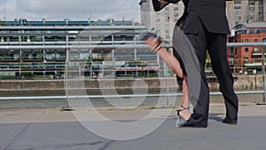 A couple of dancers doing a intimate tango in luxurious Puerto Madero docks