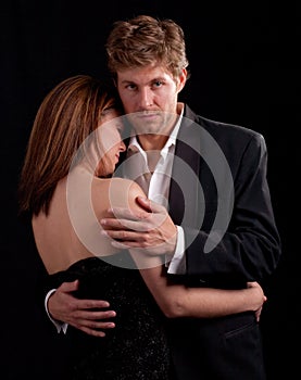 Couple Dancing Against Black Background