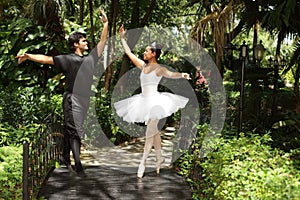 Couple dancing ballet in the park