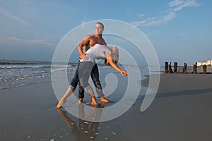 Couple dancing on the beach