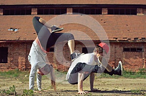 Couple dancing breakdance on the street