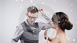 Couple, dancing or celebration in studio with champagne, care or wedding party or confetti by white background. Man