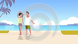 Couple dancing on sea beach man woman lovers having fun summertime summer vacation concept seaside palm tree mountains