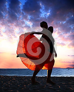 Couple dancing at sunset