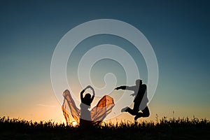 Couple dancing in the sunset