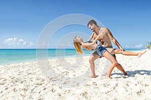 Couple dancing tango at the beach