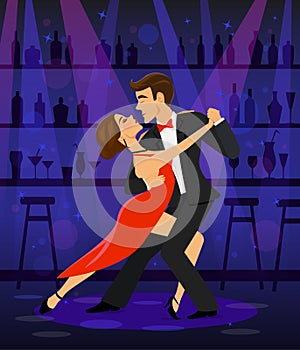 Couple dancing tango in a disco club bar