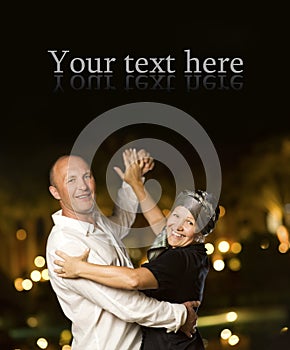 Couple dancing waltz at night photo