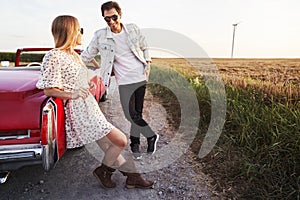 Couple on a date during a car trip at sunset