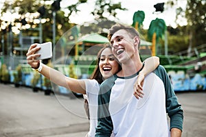 Couple Dating Amusement Park Enjoyment Hugging Concept