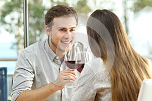 Couple dating drinking wine in a restaurant