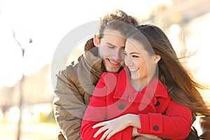 Couple dating and hugging in love in a park