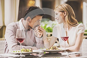 Couple Dating in Restaurant and Drinking Red Wine.