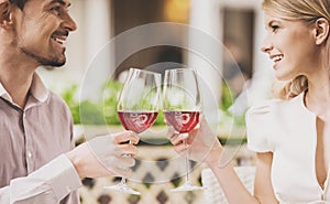 Couple Dating in Restaurant and Drinking Red Wine.