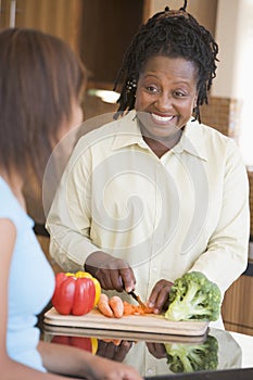 Couple With Daughter Preparing Meal