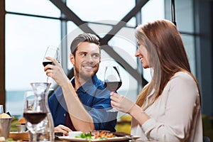 Couple dining and drinking wine at restaurant