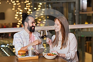 Couple dining and drinking wine at restaurant