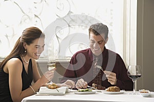 Couple dining at restaurant.