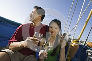 Couple dinking wine on boat