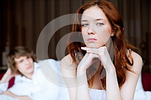 Couple in disagreement in bedroom