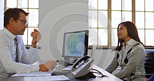 Couple discussing with adviser at his desk 4k