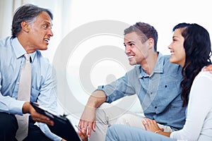 Couple discussing finance with personal advisor. Attractive young couple discussing financial plans with personal