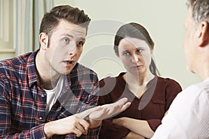 Couple Discussing Problems With Relationship Counsellor photo