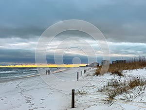 A couple walking on a Destin, Florida Beach.